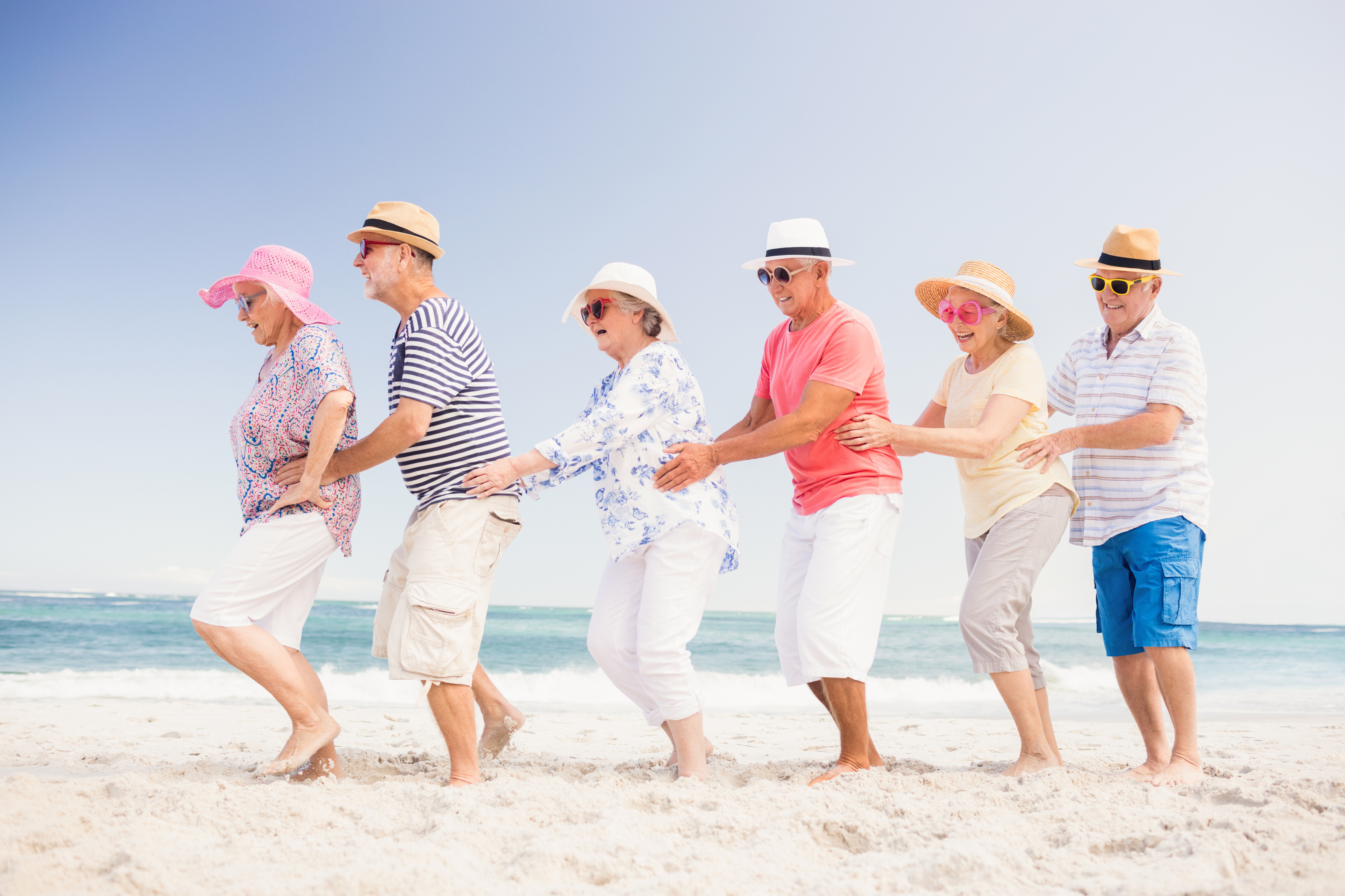 Happy senior friends dancing